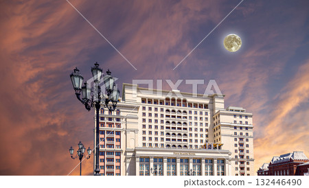 Facade of Four Seasons hotel (Hotel Moskva) from Manege Square on a beautiful sky with cloud before sunset background with the super moon. Moscow, Russia 132446490