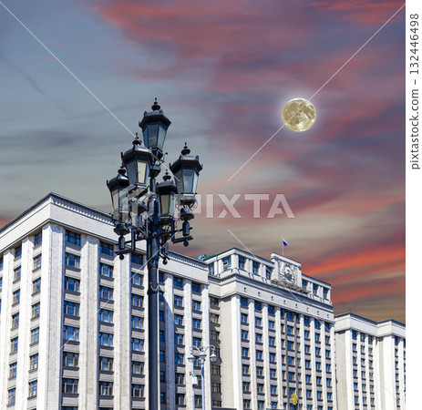 Building of The State Duma of the Federal Assembly of Russian Federation on a beautiful sky with cloud before sunset background (with the super moon), Moscow, Russia Building of The State Duma of the Federal Assembly of Russian Federation on a beautiful sky with cloud before sunset background (with the super moon), Moscow, Russia 132446498
