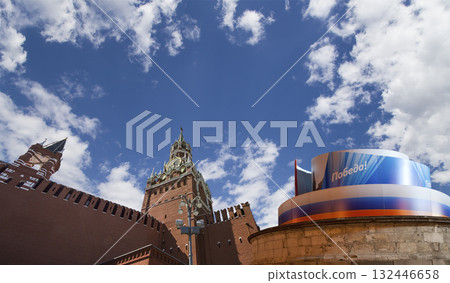 Moscow Kremlin (with decorations for the holiday of May 9 in honor of Victory Day celebration (WWII). Against the sky with clouds, Russia. TRANSLATION: Victory! 132446658