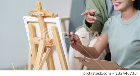 Creative Mother and Daughter Painting Together at Home Creative Mother and Daughter Painting Together at Home 132446736