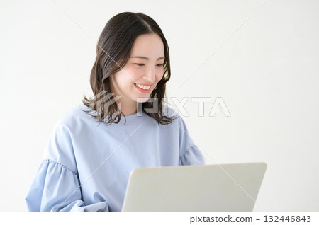 A Japanese woman operating a personal computer 132446843