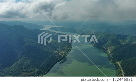 Aerial view on Danube river and mountains under clouds Aerial view on Danube river and mountains under clouds 132446881