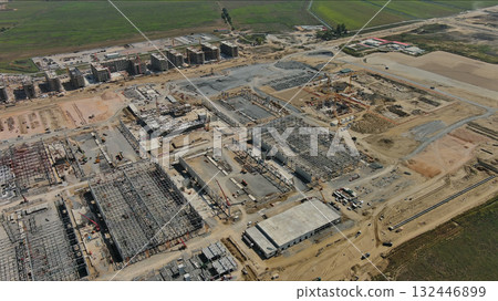 Industrial construction site with construction equipment and materials Industrial construction site with construction equipment and materials 132446899