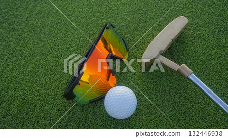 Close up of golf equipment on green grass. Close up of golf equipment on green grass. 132446938