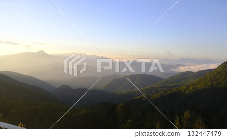 Mountains illuminated by the morning sun Mountains illuminated by the morning sun 132447479