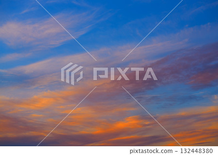 Sunset sky orange clouds over blue 132448380