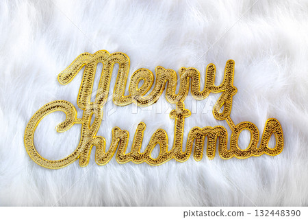 Merry christmas written in gold on white fur Merry christmas written in gold on white fur 132448390