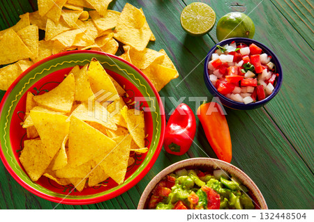 Guacamole with avocado tomatoes and nachos Guacamole with avocado tomatoes and nachos 132448504