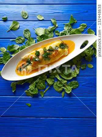 Scrambled eggs with langoustines prawns and leeks 132448638