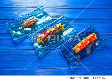 Salmon and Tuna Tartare with Anchovies 132448720