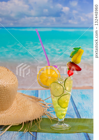 Lemon lime cocktail mojito on tropical beach 132448960