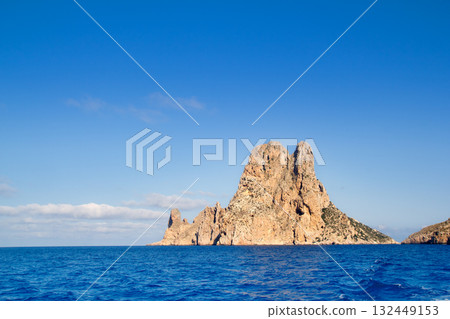 Es Vedra islet island in blue Mediterranean Es Vedra islet island in blue Mediterranean 132449153