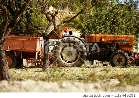 Old rusted tractor orange color in Spain Old rusted tractor orange color in Spain 132449291