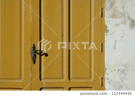 Aged wooden color door in mediterranean 132449446