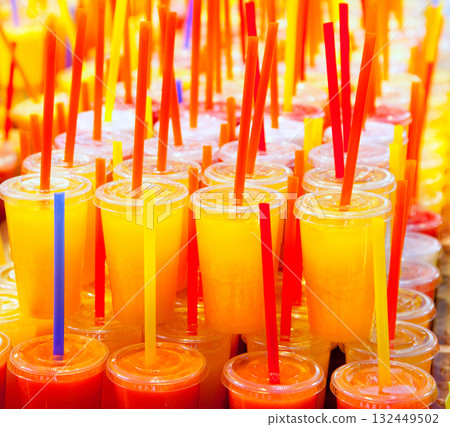 Colorful natural fresh fruits juice glasses with straw 132449502