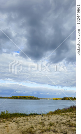 An autumn river landscape with yellow leaves on the trees, reflections An autumn river landscape with yellow leaves on the trees, reflections 132449661