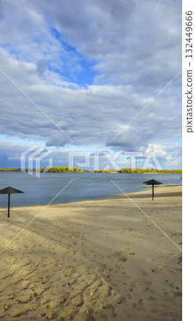 An autumn river landscape with yellow leaves on the trees, reflections 132449666