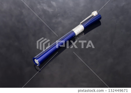 A signature fountain pen on a gray marble background. Gift set. Office decor. 132449671