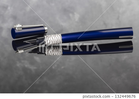 A signature fountain pen on a gray marble background. Gift set. Office decor. 132449676