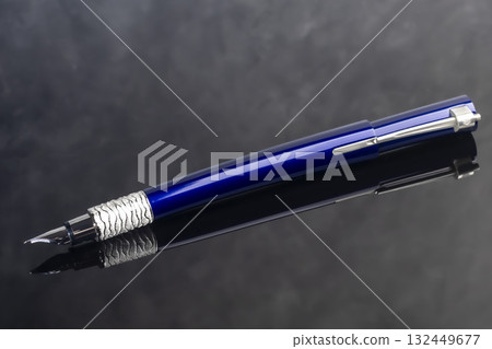 A signature fountain pen on a gray marble background. Gift set. Office decor. 132449677