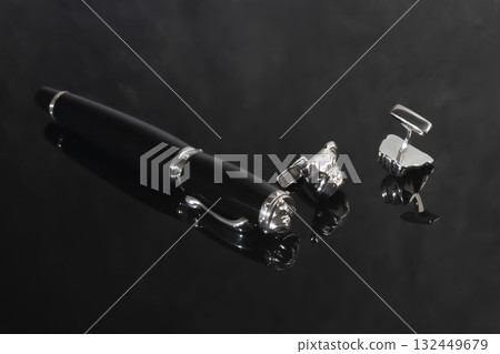 A signature fountain pen on a gray marble background. Gift set. Office decor. 132449679