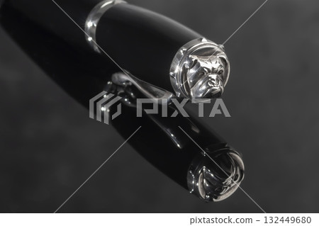 A signature fountain pen on a gray marble background. Gift set. Office decor. 132449680