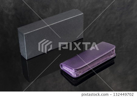 A signature fountain pen on a gray marble background. A box and case are nearby. 132449702