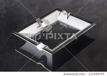 Large porcelain cigar ashtray on a marble background. Ash collector. 132449705