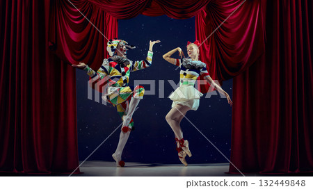 Playful stage moment. Mime and ballerina posing in colorful costumes for holiday theme. 132449848