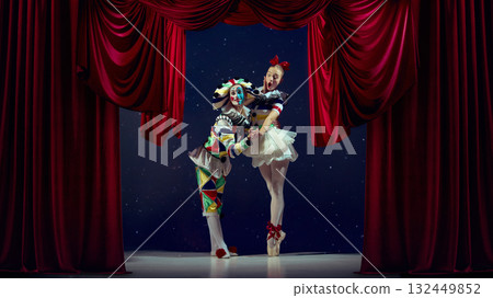 Expression in motion. Mime and ballerina posing dramatically on stage under red curtains. Expression in motion. Mime and ballerina posing dramatically on stage under red curtains. 132449852