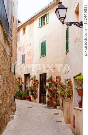 Majorca Valldemossa typical with flower pots in facade Majorca Valldemossa typical with flower pots in facade 132449885