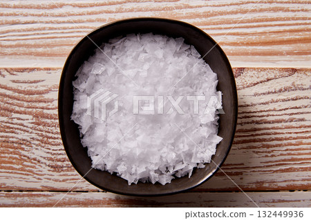 Maldon sea salt flakes in a bowl Maldon sea salt flakes in a bowl 132449936