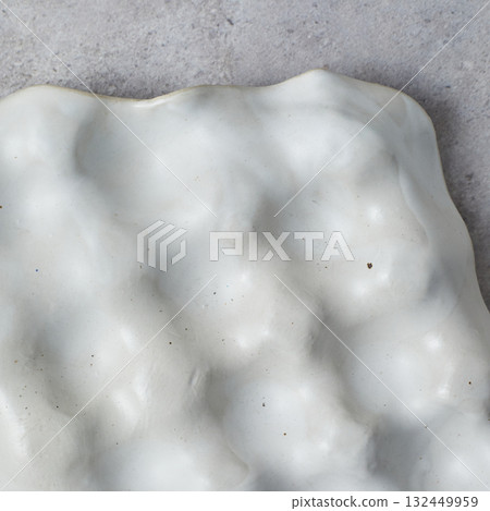 ceramic tray for jewelry on gray background. ceramic tray for jewelry on gray background. 132449959