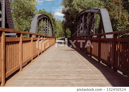Cycle path leading across the post-war double-span truss bridge in Kamienna Gora, Lower Silesia, Poland. 132450524