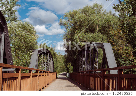 Cycle path leading across the post-war double-span truss bridge in Kamienna Gora, Lower Silesia, Poland. 132450525