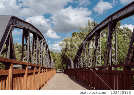 Cycle path leading across the post-war double-span truss bridge in Kamienna Gora, Lower Silesia, Poland. 132450528
