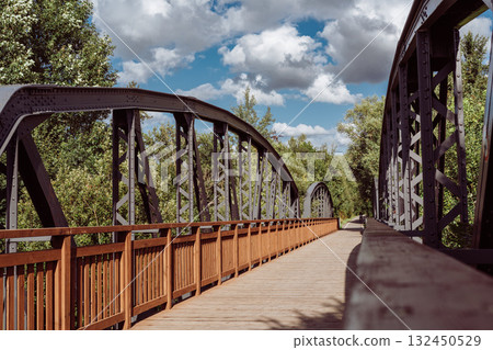 Cycle path leading across the post-war double-span truss bridge in Kamienna Gora, Lower Silesia, Poland. 132450529
