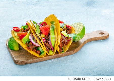 Ground beef tacos on a wooden board, Mexican food 132450794