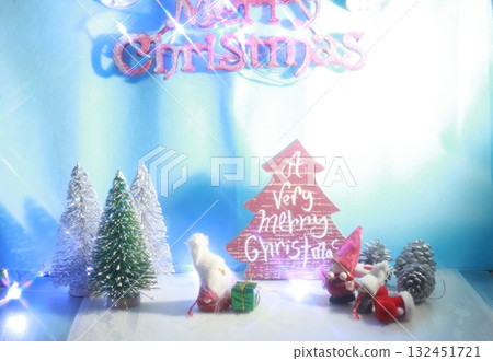 Santa Claus decorating the Christmas tree and the night sky Santa Claus decorating the Christmas tree and the night sky 132451721