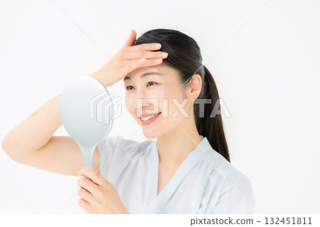 Woman looking in the mirror Beauty Woman looking in the mirror Beauty 132451811