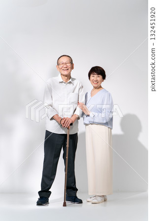 Senior couple portrait walking stick 132451920