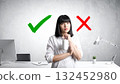 A young woman in an apron 132452980