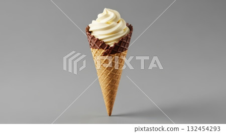 Delicious vanilla soft serve in chocolate-dipped waffle cone against gray background 132454293