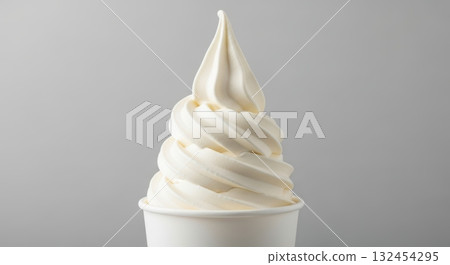 Delicious vanilla soft serve ice cream in cup against gray background 132454295