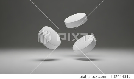 Floating white pills on a gray background with minimalistic design 132454312