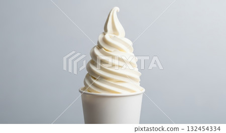 Vanilla soft serve ice cream in white cup against minimalistic background 132454334