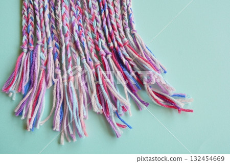 Colorful friendship bracelets lined up as handmade accessory materials 132454669