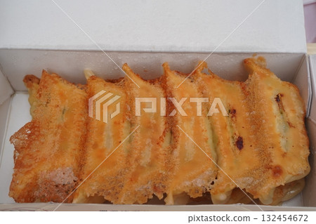 Takeout Utsunomiya gyoza: a plate of fragrant, freshly baked dumplings Takeout Utsunomiya gyoza: a plate of fragrant, freshly baked dumplings 132454672