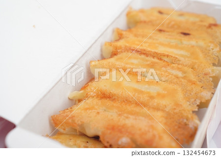 A bright food photo of gyoza wings taken from an angle 132454673