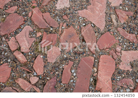 Old brown paving top view or granite cobblestone road. Ancient brick cobblestone tiles street 132454850